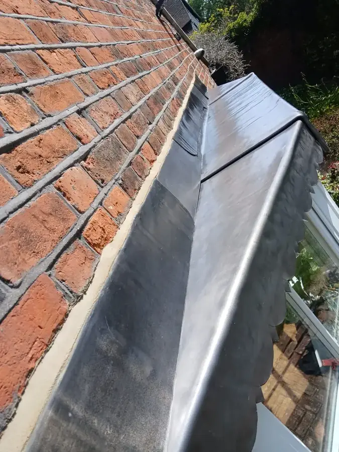 Close-up of new welted lead seams and drip edge on Upminster bay roof